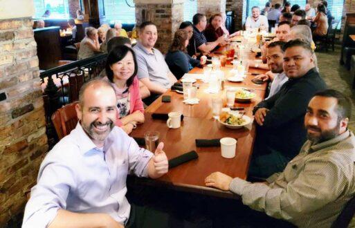 PCI Energy Solutions staff enjoy dinner together after a quarterly all-employee meeting.