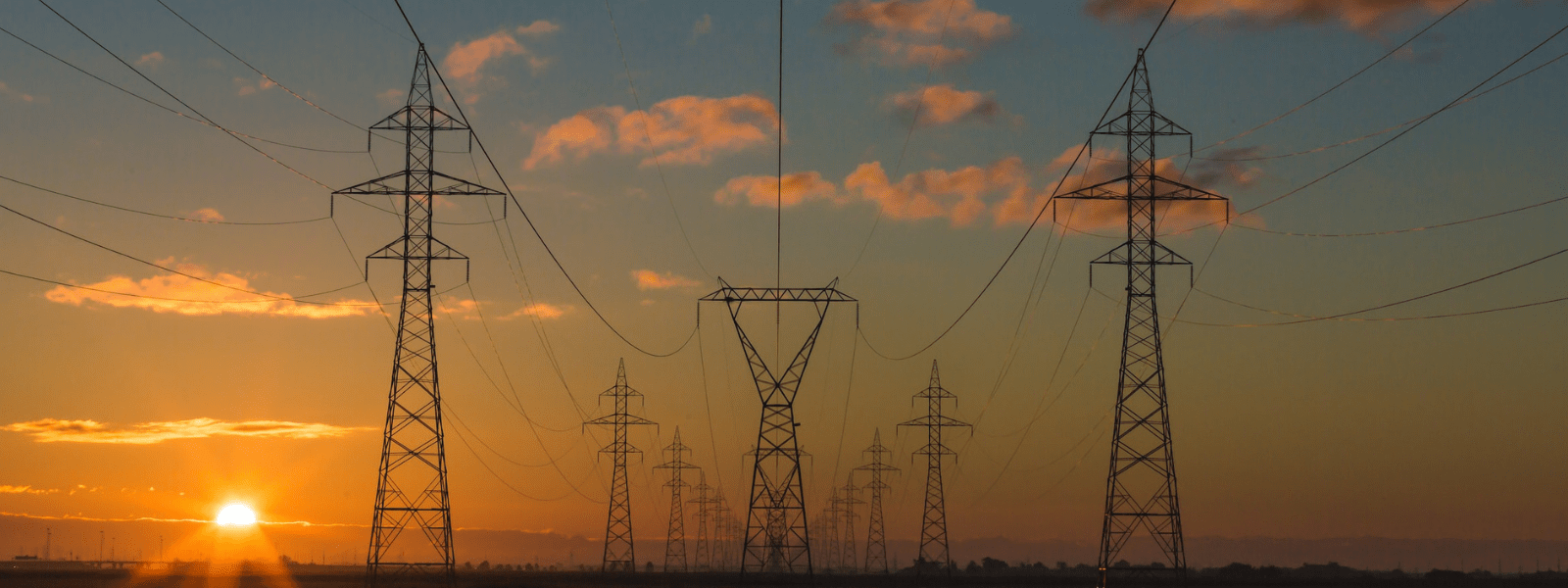 Transmission lines at sunset
