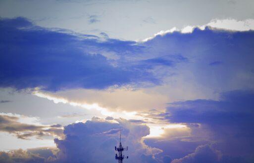 clouds and transmission tower